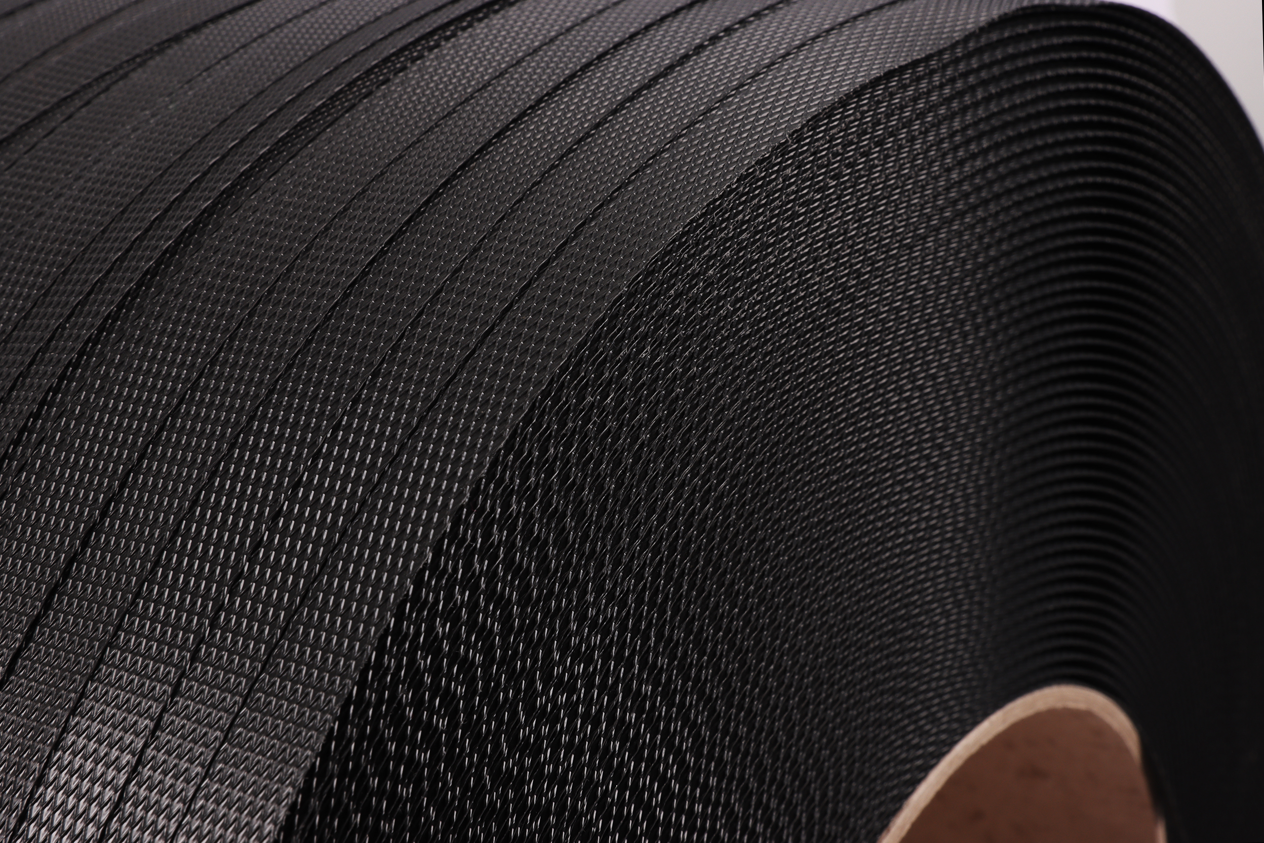 PP-Band Schwarz, 12x0,55mm, 200mm Kern, Reisskraft ca. 133kg, 3.000m pro Rolle